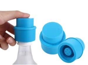 Blue bottle pump cap for transforming regular bottles into carbonated drinks quickly and easily.